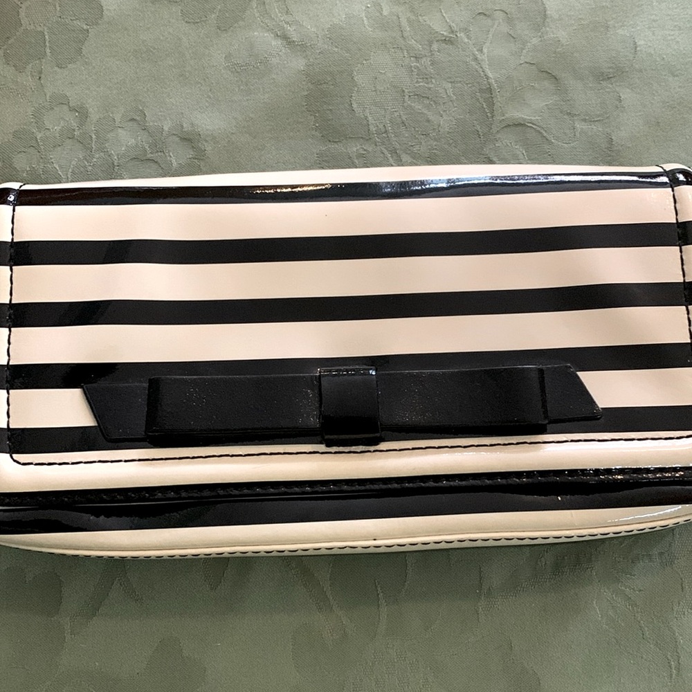 Kate Spade Chelsea Park striped patent clutch with bow